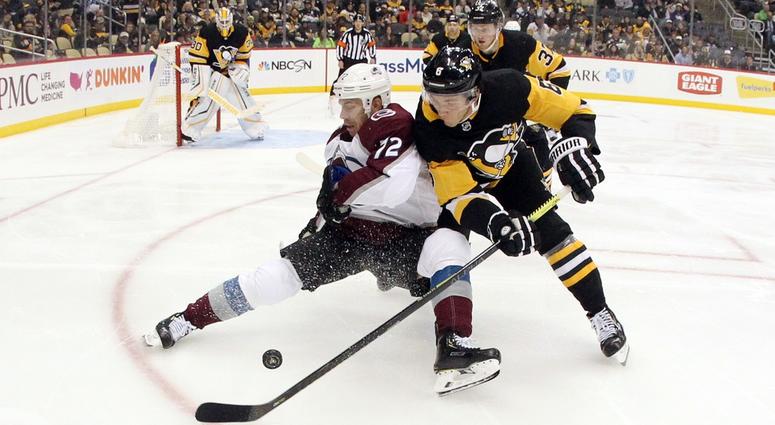 Colorado Avalanche right wing Joonas Donskoi is checked off of the puck by Pittsburgh Penguins defenseman John Marino Colorado Avalanche right wing Joonas Donskoi is checked off of the puck by Pittsburgh Penguins defenseman John Marino