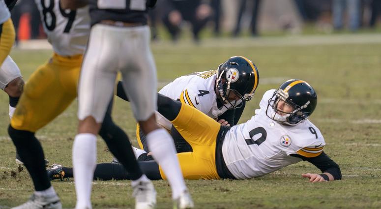 Pittsburgh Steelers kicker Chris Boswell (9) slips during a field goal attempt to tie the game against the Oakland Raiders during the fourth quarter at Oakland Coliseum.
