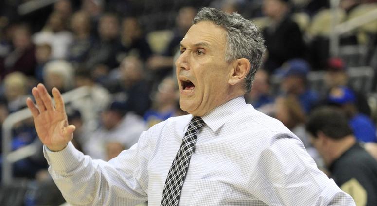 Duquesne Dukes head coach Frank Dambrot reacts on the bench against the Pittsburgh Panthers during the first half at PPG Paints Arena.