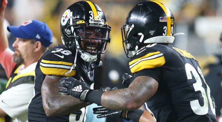 Pittsburgh Steelers running back Jaylen Samuels (38) congratulates running back James Conner (30) on his touchdown against the Cincinnati Bengals during the second quarter at Heinz Field.