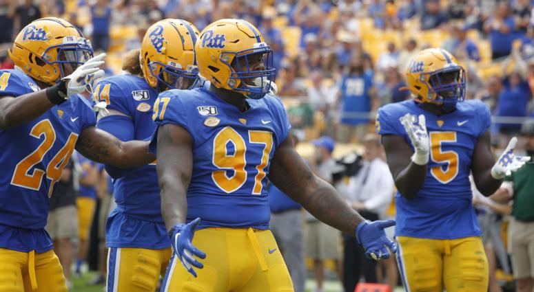 Pittsburgh Panthers linebacker Phil Campbell III (24) and linebacker Elias Reynolds (44) and defensive lineman Jaylen Twyman (97) and defensive lineman Deslin Alexandre (5) celebrate a defensive stop ...