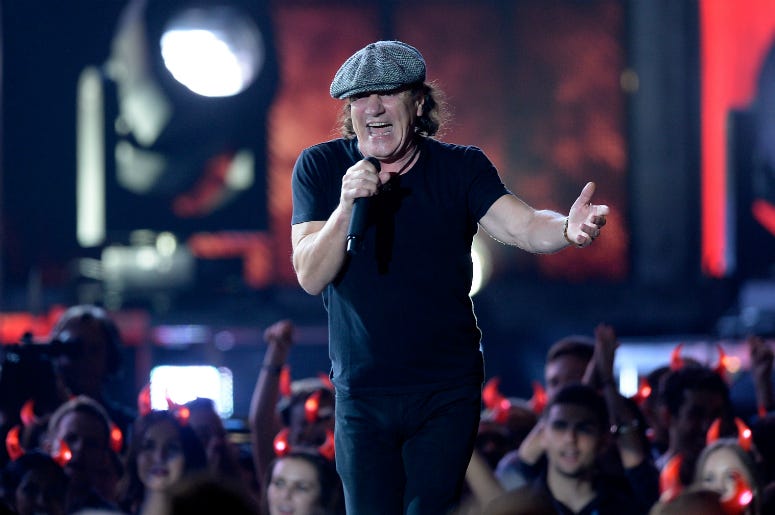 Singer Brian Johnson of AC/DC performs onstage during The 57th Annual GRAMMY Awards Singer Brian Johnson of AC/DC performs onstage during The 57th Annual GRAMMY Awards