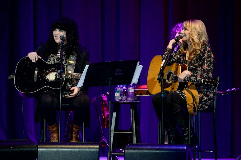Musicians Ann Wilson (L) and Nancy Wilson perform onstage Musicians Ann Wilson (L) and Nancy Wilson perform onstage