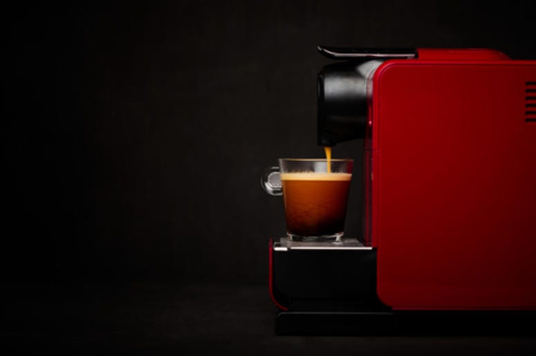 Keurig machine brewing coffee Keurig machine brewing coffee