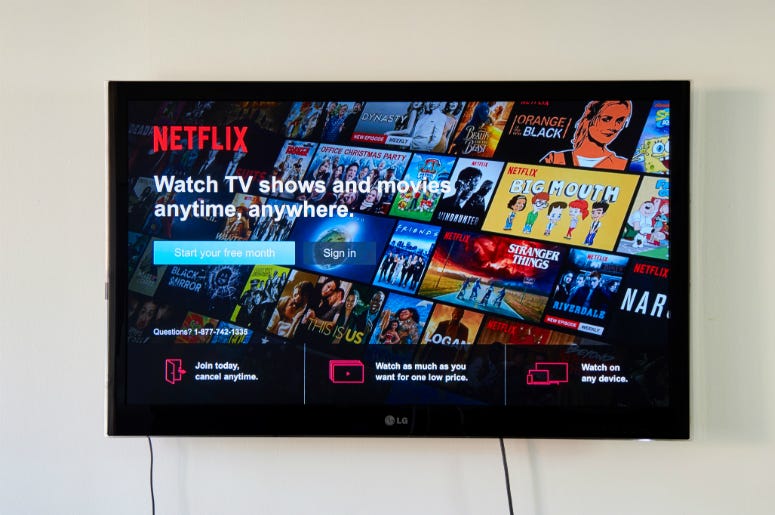 Netflix sign-in page on an LG TV. MONTREAL, CANADA - NOVEMBER 15, 2017: Netflix Sign In and free trial page on LG TV. Netflix is an American entertainment company founded by Reed Hastings and Marc Randolph on August 1997, in CA USA