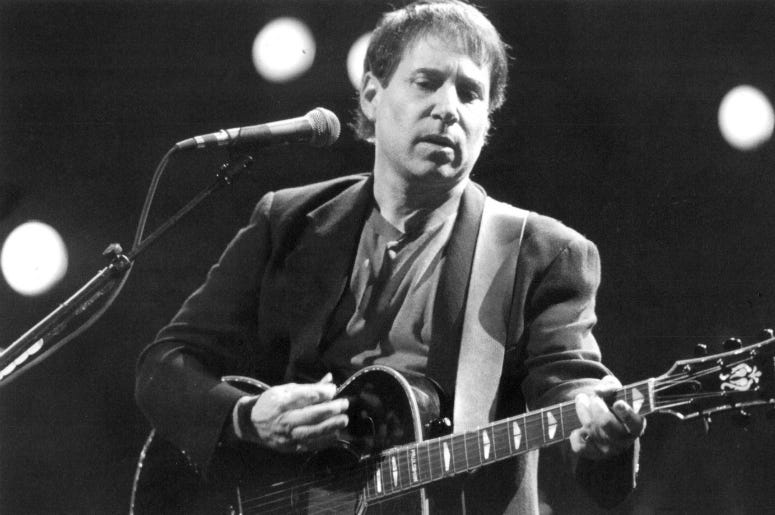 Apr 11, 1991; Rochester, NY, USA; Paul Simon performs at Rochester Community War Memorial. Apr 11, 1991; Rochester, NY, USA; Paul Simon performs at Rochester Community War Memorial.