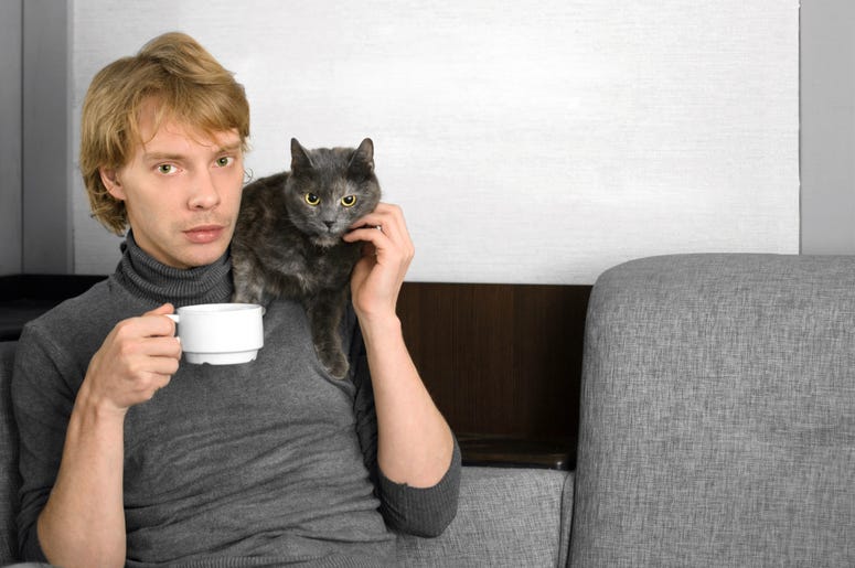 Man holds cat