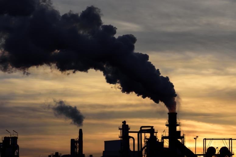 factories emitting pollution into atmosphere