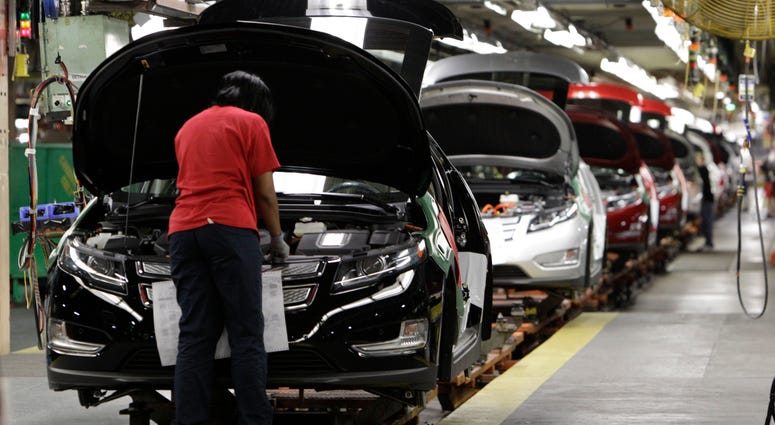 assembly worker Julaynne Trusel works on a Chevrolet Volt at the General Motors Hamtramck Assembly plant in Hamtramck, Mich. assembly worker Julaynne Trusel works on a Chevrolet Volt at the General Motors Hamtramck Assembly plant in Hamtramck, Mich.