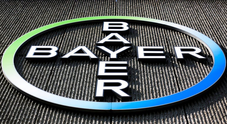 0 1 0 FILE - This Monday, May 23, 2016, file photo, shows the Bayer AG corporate logo displayed on a building of the German drug and chemicals company in Berlin.