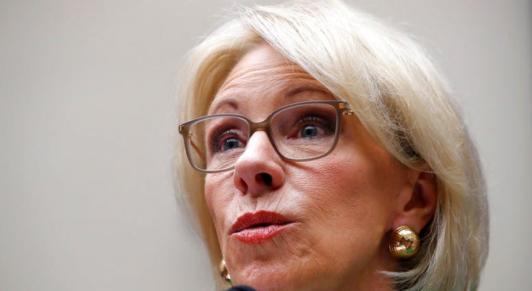 FILE - In this May 22, 2018 file photo, Education Secretary Betsy DeVos testifies at a House Committee on Education and the Workforce, n Capitol Hill in Washington.