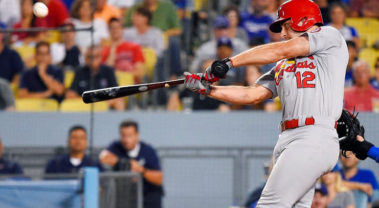St. Louis Cardinals' Paul DeJong hits a two-run home run during the ninth inning of a baseball game against the Los Angeles Dodgers on Wednesday, Aug. 22, 2018, in Los Angeles.
