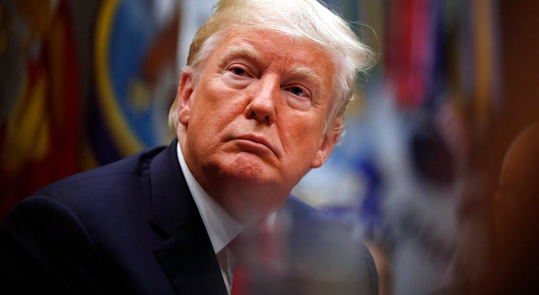 President Donald Trump listens during a discussion for drug-free communities support programs, in the Roosevelt Room of the White House, Wednesday, Aug. 29, 2018, in Washington.