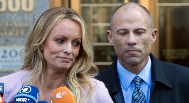 In this April 16, 2018 file photo, adult film actress Stormy Daniels, left, stands with her lawyer Michael Avenatti as she speaks outside federal court, in New York.