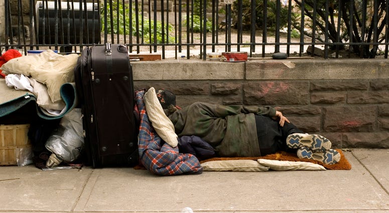 homeless person on sidewalk