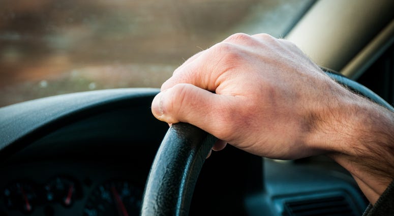 hand on steering wheel