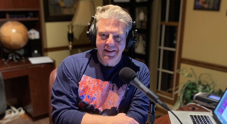 Marc broadcasting from his home office