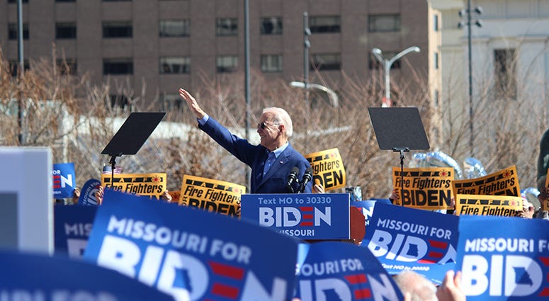 Joe waving at the crowd in St. Louis