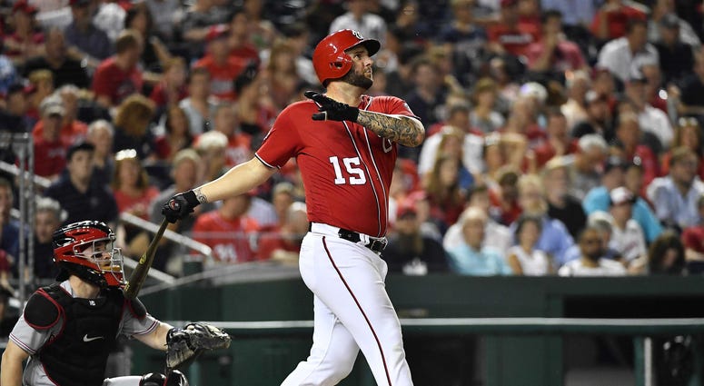 Aug 4, 2018; Washington, DC, USA; Washington Nationals first baseman Matt Adams (15) watches his solo home run during the fifth inning against the Cincinnati Reds at Nationals Park.