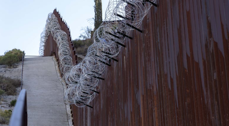 Border fence near DeConcini crossing at Arizona-Mexico border in Nogales, Arizona