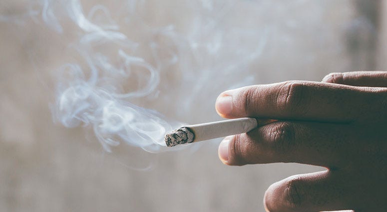 hand holding cigarette smoking