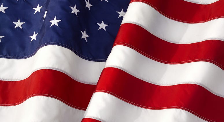 Waving American Flag Iconic Symbol of Patriotism Closeup.