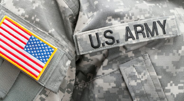 US flag and U. S. ARMY patch on military uniform - studio shot.