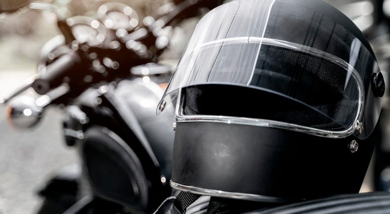 helmet on seat of motorcycle
