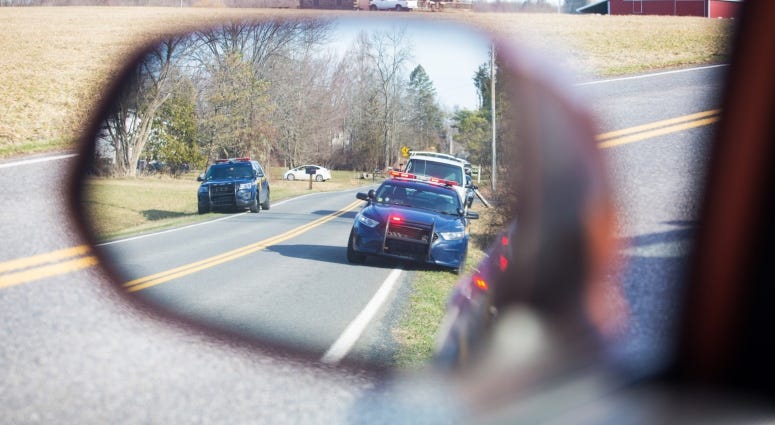 mirror with police cars in reflection