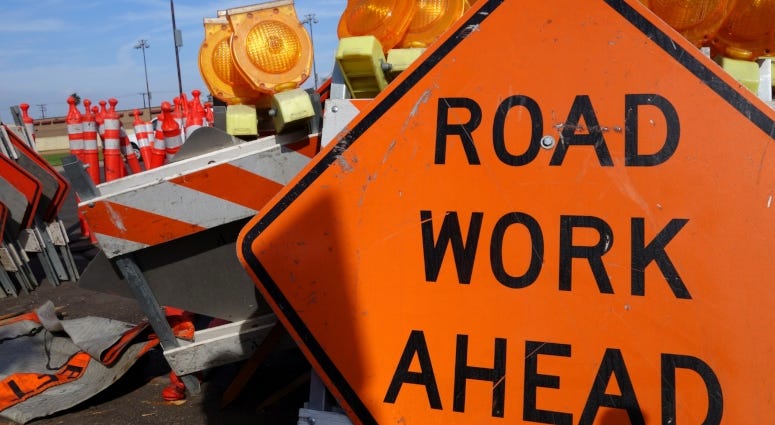 road work ahead sign on highway