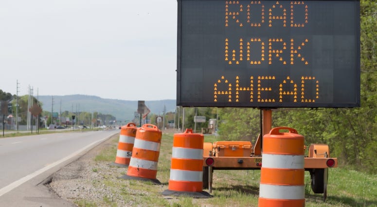 road work ahead sign on highway