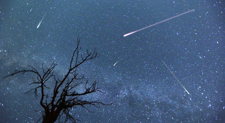 meteors and stars in the night sky