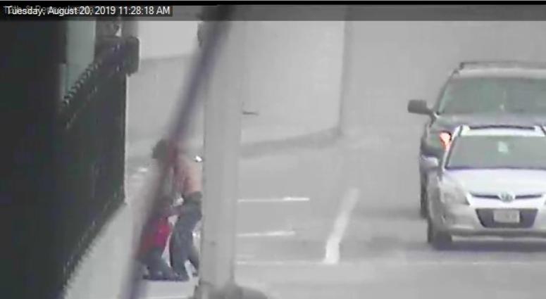 man dragging life-size doll