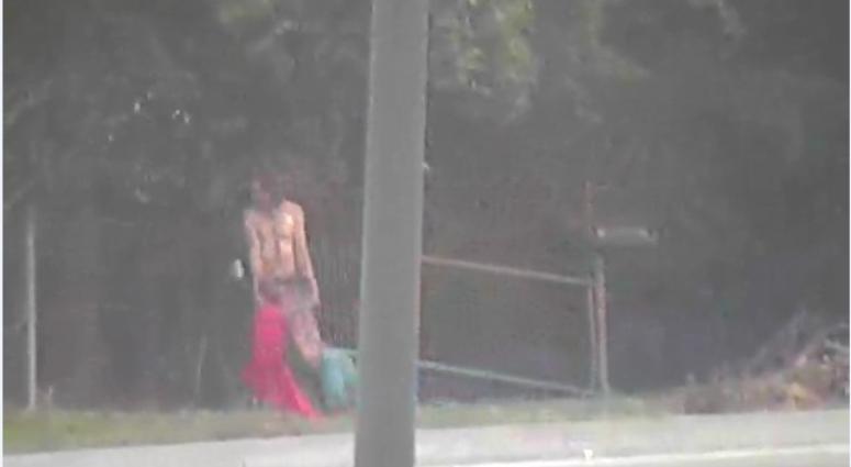 man dragging life-size doll