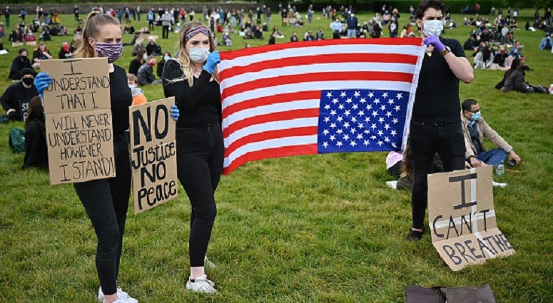 How has the world reacted to the United States protesting during the death of George Floyd?