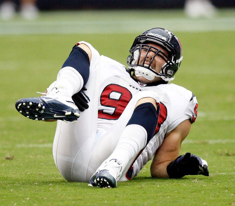 Defensive end Connor Barwin #98 of the Houston Texans goes down with an injury in the first quarter against the Indianapolis Colts during the NFL season opener at Reliant Stadium on September 12, 2010 in Houston, Texas.