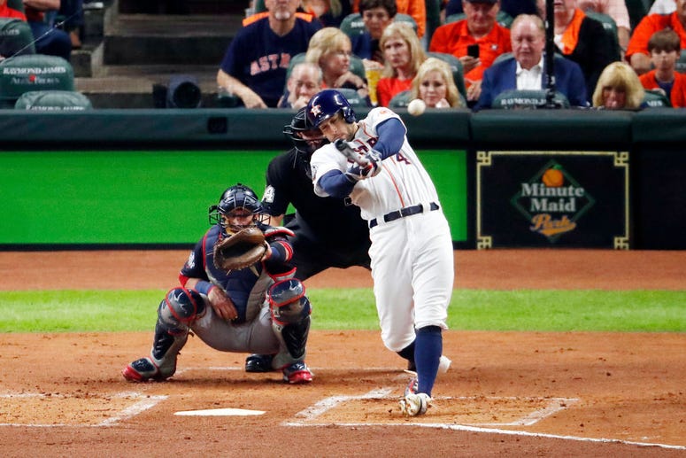 George Springer #4 of the Houston Astros hits a leadoff double against the Washington Nationals during the first inning in Game Six of the 2019 World Series at Minute Maid Park on October 29, 2019 in Houston, Texas.
