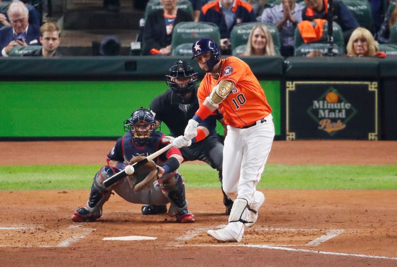 Yuli Gurriel #10 of the Houston Astros hits a solo home run against the Washington Nationals during the second inning in Game Seven of the 2019 World Series at Minute Maid Park on October 30, 2019 in Houston, Texas.