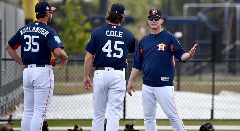 Houston Astros manager A.J. Hinch (right) laughs with Astros starting pitcher Gerrit Cole (center) and Astros starting pitcher Justin Verlander (left) prior to their workouts at The Ballparks of the Palm Beaches.