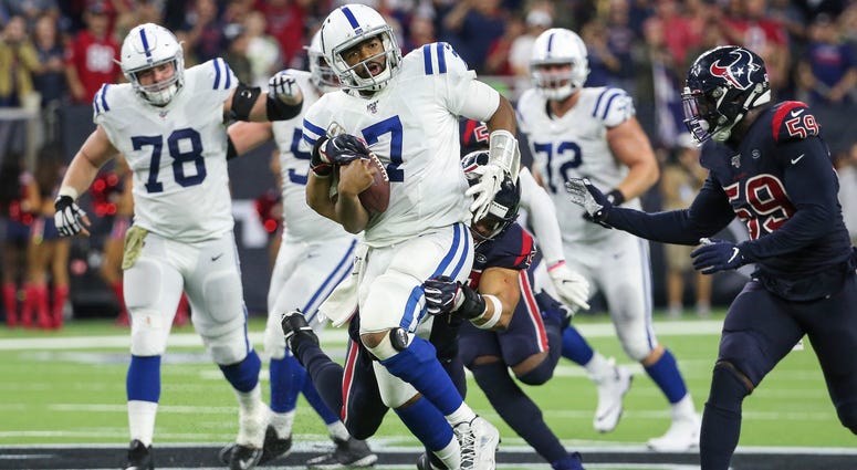 Texans outside linebacker Brennan Scarlett tackles Colts quarterback Jacoby Brissett
