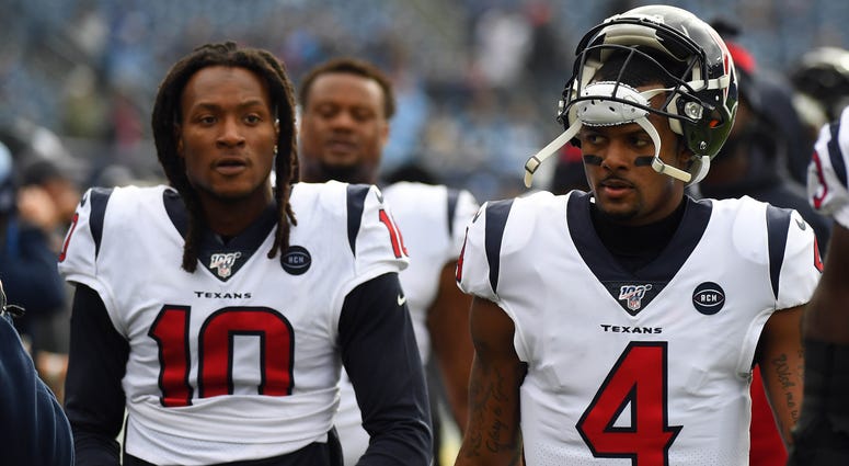 Houston Texans quarterback Deshaun Watson (4) and Houston Texans wide receiver DeAndre Hopkins (10) walk off the field after warmups before the game against the Tennessee Titans at Nissan Stadium.