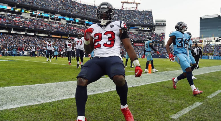 Houston Texans running back Carlos Hyde (23) runs for a touchdown during the second half against the Tennessee Titans at Nissan Stadium.