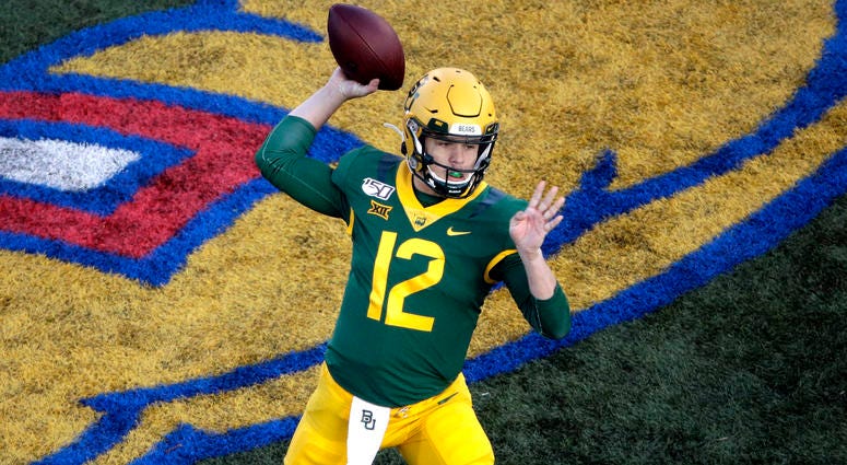 Baylor quarterback Charlie Brewer passes the ball during the first half of an NCAA college football game against Kansas, Saturday, Nov. 30, 2019, in Lawrence, Kan.