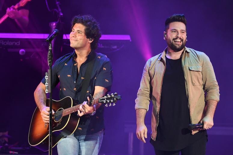 Recording artists Dan Smyers and Shay Mooney of Dan + Shay perform at the Coral Sky Smphitheatre Recording artists Dan Smyers and Shay Mooney of Dan + Shay perform at the Coral Sky Smphitheatre