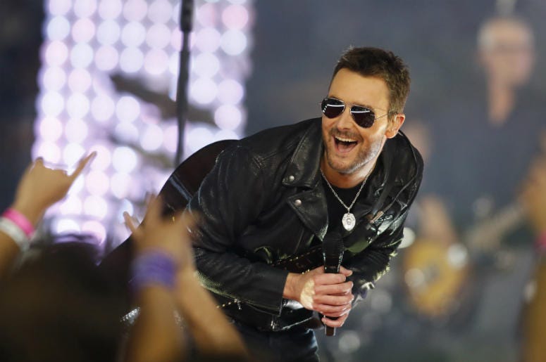 Eric Church performs during the halftime of the game between the Dallas Cowboys and the Washington Redskins at AT&T Stadium. Dallas won 31-26. Eric Church performs during the halftime of the game between the Dallas Cowboys and the Washington Redskins at AT&T Stadium. Dallas won 31-26.