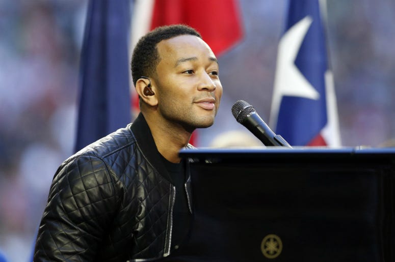John Legend performs before Super Bowl XLIX between the New England Patriots and the Seattle Seahawks at University of Phoenix Stadium. John Legend performs before Super Bowl XLIX between the New England Patriots and the Seattle Seahawks at University of Phoenix Stadium.