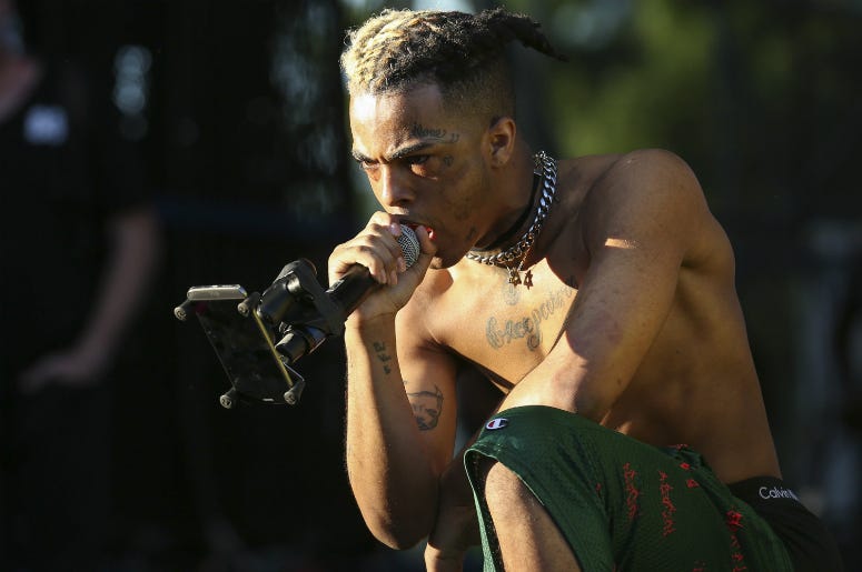 XXXTentacion XXXTentacion performs during the second day of the Rolling Loud Festival in downtown Miami on Saturday, May 6, 2017.