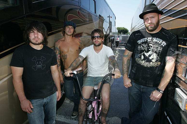 Musicians Jordan Buckley, Michael Novak Jr., Keith Buckley and Chris Byrnes of the band Every Time I Die pose backstage at the Vans Warped Tour on August 5, 2006 in Uniondale, New York Musicians Jordan Buckley, Michael Novak Jr., Keith Buckley and Chris Byrnes of the band Every Time I Die pose backstage at the Vans Warped Tour on August 5, 2006 in Uniondale, New York