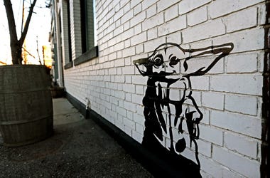 Syndication: Milwaukee Artist Michael Cerda Artist Michael Cerda painted a baby Yoda onto Hotel Madrid in Walker's Point. Mjs Babyyoda00p1