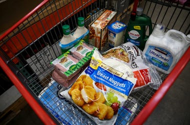 Luke Clifton fills a shopping cart from a list given to him by a family using the PDX Deliver service on Wednesday, Aug. 19, 2020 at Costco in Salem, Oregon. Grocerydelivery002 Luke Clifton fills a shopping cart from a list given to him by a family using the PDX Deliver service on Wednesday, Aug. 19, 2020 at Costco in Salem, Oregon. Grocerydelivery002